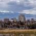 landscape view of the Reno central business district with snowcapped mountains in the distance beyond