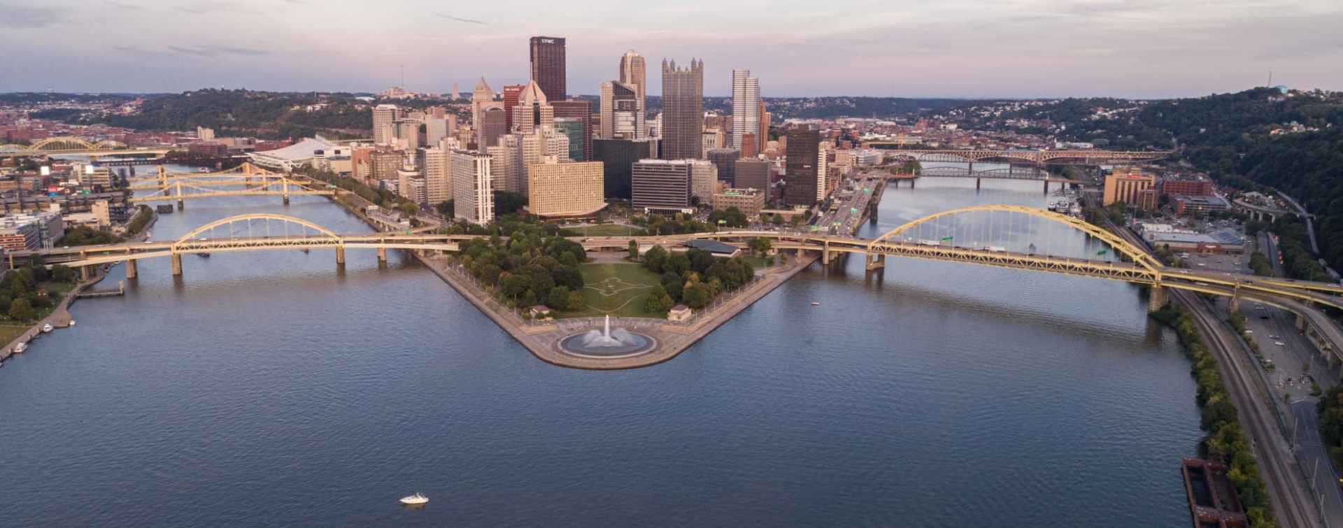 aerial apnoramic view of pittsburgh central business district buildings on island connected by bridges across the river