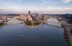 aerial apnoramic view of pittsburgh central business district buildings on island connected by bridges across the river